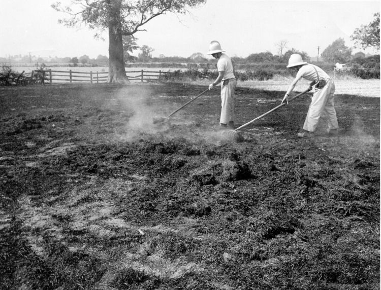 Frank Trowman and Brian Parsons at a field fire at Beckford 1976
