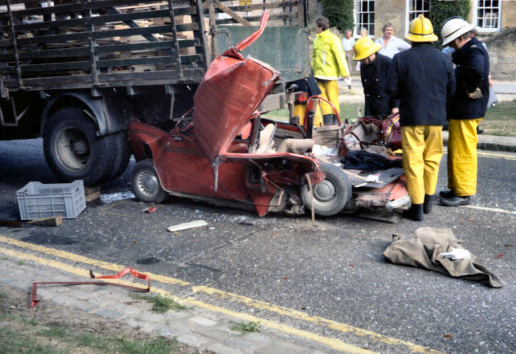 Mini crushed between a bus and a lorry in High Street Broadway July 1989